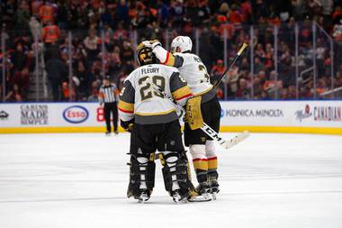 Golden Knights goaltender Marc-Andre Fleury (29) and Brayden McNabb (3) celebrate their 3-2 overtime victory over the Edmonton Oilers after an NHL hockey game, Monday, March 9, 2020, in Edmonton, Alberta. 