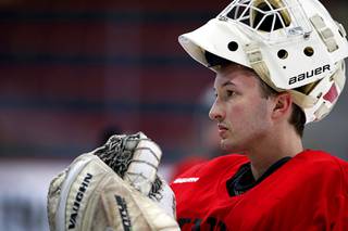UNLV goaltender Bryce Crowley listens to coaching staff during UNLV hockey practice at City National Arena in Summerlin Thursday, March 12, 2020.