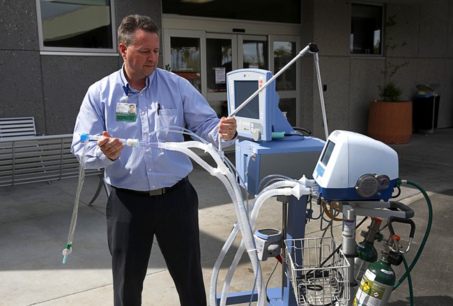 Ryan Hamblin, director of respiratory at Sunrise Hospital and Medical Center, displays medical ventilators at Sunrise Hospital Thursday, March 19, 2020. The hospital has 120 ICU ventilators as well as transport ventilators and other machines that can be used as ventilators, said Rob Smith II, associate chief medical officer.