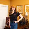 Maria Bailey, owner of Success City Online, poses for a photo in her home based office, Thursday March 19, 2020.