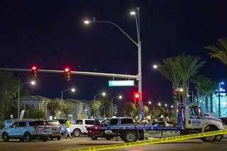 Metro Police work the scene of a fatal single-car accident on Silverado Ranch and Las Vegas boulevards Saturday, March 21, 2020. The driver, the sole occupant, died in the crash.