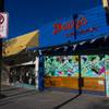 Davy's at Rebar is boarded up and covered with a mural by artist Geneva Marquez on Main Street, downtown, Tuesday, March 24, 2020.