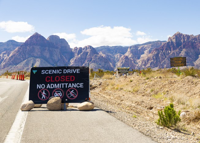 A sign indicates closure of the Red Rock Canyon scenic ...