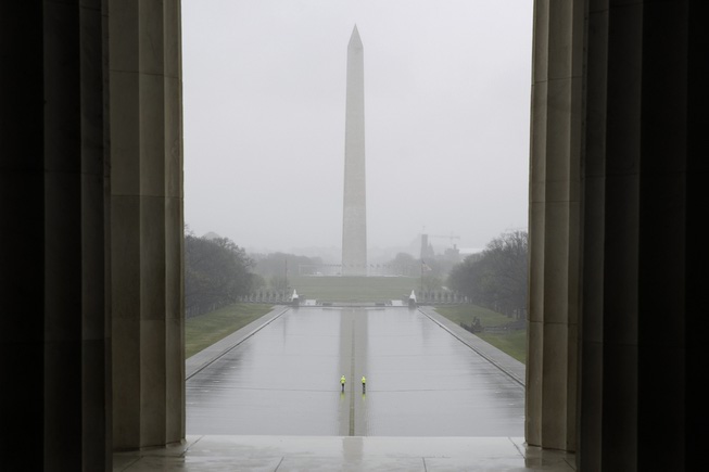 People walk in an empty Lincoln Memorial Reflecting Pool in ...