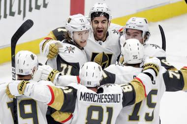 Vegas Golden Knights left wing Max Pacioretty (67), top center, celebrates with teammates after scoring the tying goal against the Nashville Predators with under one second remaining in the third period of an NHL hockey game Wednesday, Nov. 27, 2019, in Nashville, Tenn. The Golden Knights won 4-3 in overtime. 