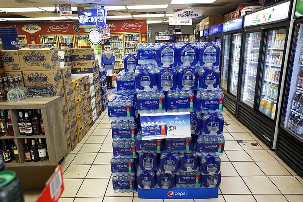 Bottled water is stacked in the Stage Door Casino at Flamingo Road and Linq Lane Tuesday, March 31, 2020. The casino is closed but the market is still open.
