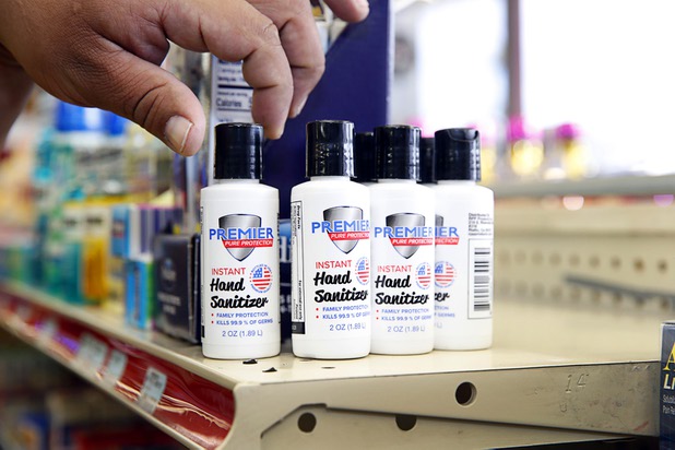Customer Eddie Quintanilla looks over a bottle of hand sanitizer at the Stage Door Casino at Flamingo Road and Linq Lane Tuesday, March 31, 2020. The casino is closed but the market is still open.