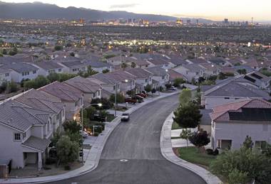 The Las Vegas Strip is shown at dusk from a neighborhood in Henderson. The coronavirus pandemic is disrupting how homes are being bought and sold in Southern Nevada.