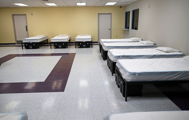 Catholic Charities Reopens Shelter - Beds are shown in an isolation ...