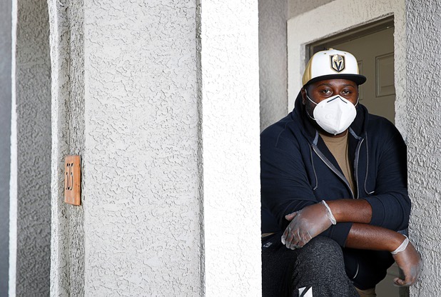 Nathaniel Manns, a bell captain at the Flamingo, poses outside his apartment in Henderson Wednesday, April 8, 2020.