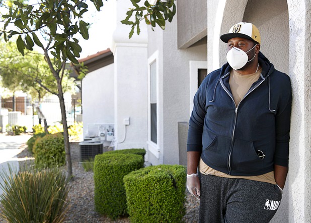 Nathaniel Manns, a bell captain at the Flamingo, poses outside his apartment in Henderson Wednesday, April 8, 2020.