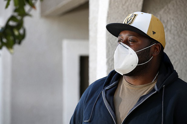 Nathaniel Manns, a bell captain at the Flamingo, poses outside his apartment in Henderson Wednesday, April 8, 2020.