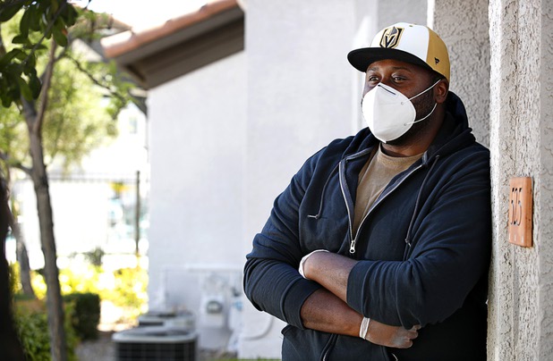 Nathaniel Manns, a bell captain at the Flamingo, poses outside his apartment in Henderson Wednesday, April 8, 2020.