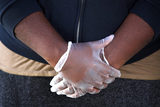 Nathaniel Manns, a bell captain at the Flamingo, is shown with protective gloves outside his apartment in Henderson Wednesday, April 8, 2020.