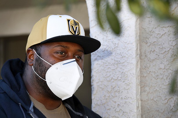 Nathaniel Manns, a bell captain at the Flamingo, poses outside his apartment in Henderson Wednesday, April 8, 2020.
