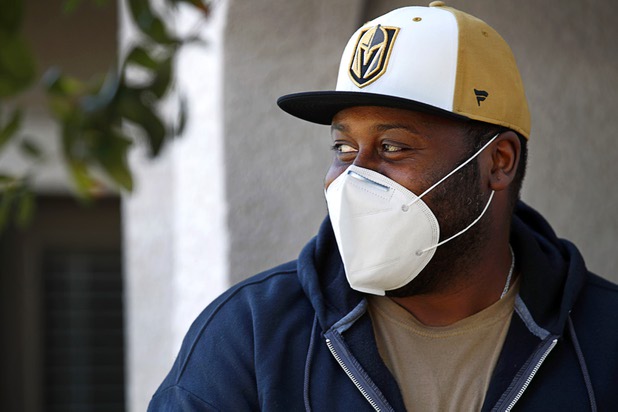 Nathaniel Manns, a bell captain at the Flamingo, poses outside his apartment in Henderson Wednesday, April 8, 2020.
