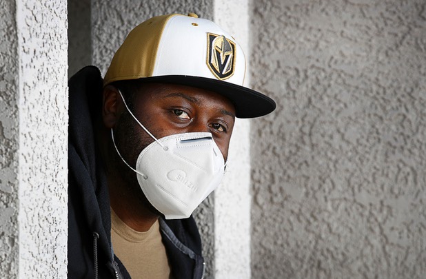 Nathaniel Manns, a bell captain at the Flamingo, poses outside his apartment in Henderson Wednesday, April 8, 2020.
