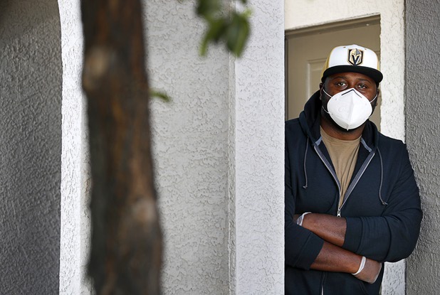 Nathaniel Manns, a bell captain at the Flamingo, poses outside his apartment in Henderson Wednesday, April 8, 2020.