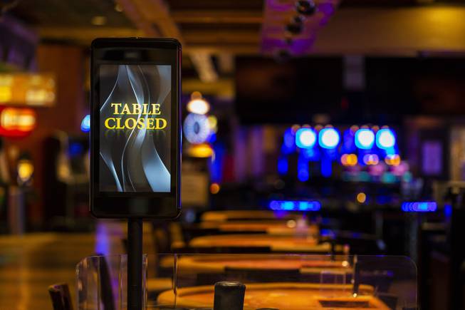 A sign displayed table closed on the gambling floor at Treasure Island during the COVID-19 government mandated shutdown, Thursday, April 9, 2020.