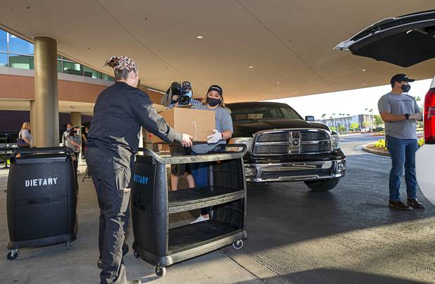 Workers representing Matter Real Estate and Burke Construction deliver 450 meals for healthcare workers, part of one of its final deliveries made through the "UnCommon Heroes" project, at Spring Valley Hospital Medical Center Friday, April 24, 2020. Matter and Burke are preparing to start work on Uncommons, a mixed-use development near I-215 and Durango Road in the southwest valley.