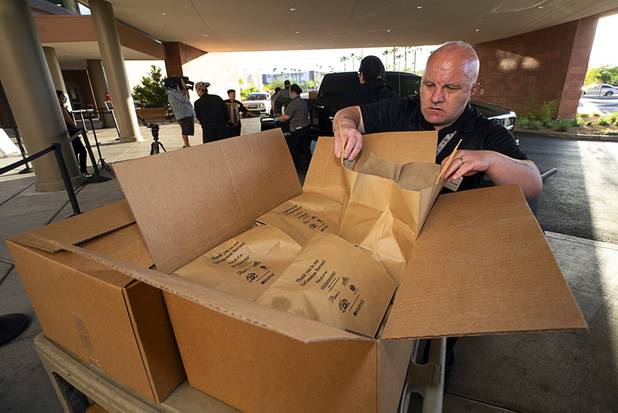 Hospital staff load meals on carts as workers representing Matter Real Estate and Burke Construction deliver 450 meals for healthcare workers, part of one of its final deliveries made through the "UnCommon Heroes" project, at Spring Valley Hospital Medical Center Friday, April 24, 2020. Matter and Burke are preparing to start work on Uncommons, a mixed-use development near I-215 and Durango Road in the southwest valley.