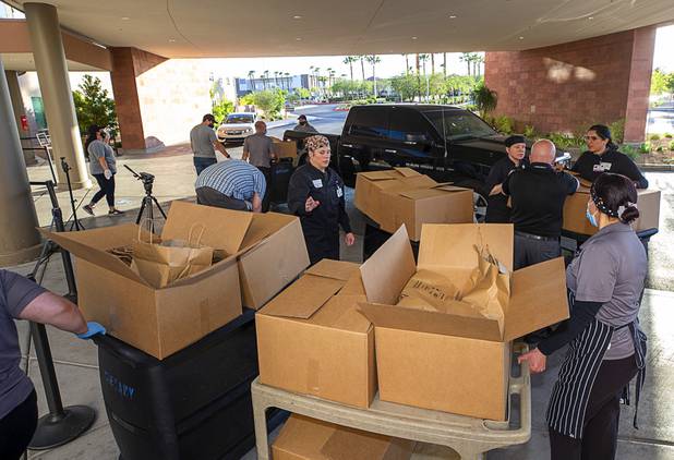 Hospital staff load meals on carts as workers representing Matter Real Estate and Burke Construction deliver 450 meals for healthcare workers, part of one of its final deliveries made through the "UnCommon Heroes" project, at Spring Valley Hospital Medical Center Friday, April 24, 2020. Matter and Burke are preparing to start work on Uncommons, a mixed-use development near I-215 and Durango Road in the southwest valley.