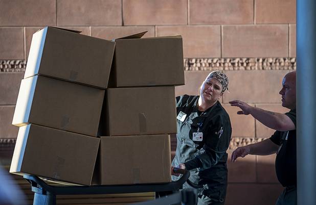 Hospital staff use carts to bring in meals as workers representing Matter Real Estate and Burke Construction deliver 450 meals for healthcare workers, part of one of its final deliveries made through the "UnCommon Heroes" project, at Spring Valley Hospital Medical Center Friday, April 24, 2020. Matter and Burke are preparing to start work on Uncommons, a mixed-use development near I-215 and Durango Road in the southwest valley.
