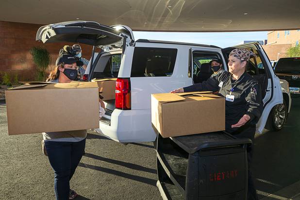 Workers representing Matter Real Estate and Burke Construction deliver 450 meals for healthcare workers, part of one of its final deliveries made through the "UnCommon Heroes" project, at Spring Valley Hospital Medical Center Friday, April 24, 2020. Matter and Burke are preparing to start work on Uncommons, a mixed-use development near I-215 and Durango Road in the southwest valley.