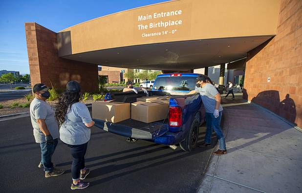 Workers representing Matter Real Estate and Burke Construction deliver 450 meals for healthcare workers, part of one of its final deliveries made through the "UnCommon Heroes" project, at Spring Valley Hospital Medical Center Friday, April 24, 2020. Matter and Burke are preparing to start work on Uncommons, a mixed-use development near I-215 and Durango Road in the southwest valley.