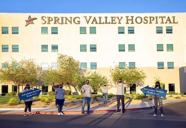 Workers representing Matter Real Estate and Burke Construction pose for a photo after delivering 450 meals for healthcare workers, part of one of its final deliveries made through the "UnCommon Heroes" project, at Spring Valley Hospital Medical Center Friday, April 24, 2020. Matter and Burke are preparing to start work on Uncommons, a mixed-use development near I-215 and Durango Road in the southwest valley.