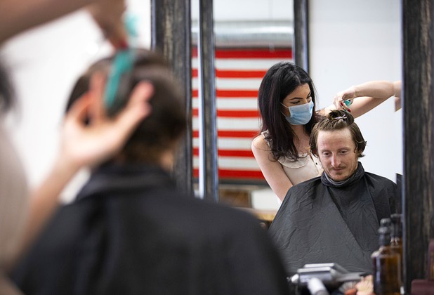Jade Evans gets his hair cut by stylist Eden Walton at Makeshift Union, on California Avenue by Casino Center Boulevard Saturday, May 9, 2020. Saturday was the first day restaurants, salons and other nonessential businesses were allowed to reopen after restrictions were imposed to help slow the spread of the new coronavirus.