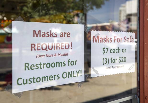 A sign gives notice that masks are required at Antique Alley Mall, 1131 S. Main Street, Saturday, May 9, 2020. Saturday was the first day restaurants, salons and other nonessential businesses were allowed to reopen after restrictions were imposed to help slow the spread of the new coronavirus.