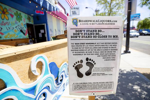 A sign is displayed at Boardwalk Liquors on Main Street Saturday, May 9, 2020. Saturday was the first day restaurants, salons and other nonessential businesses were allowed to reopen after restrictions were imposed to help slow the spread of the new coronavirus.