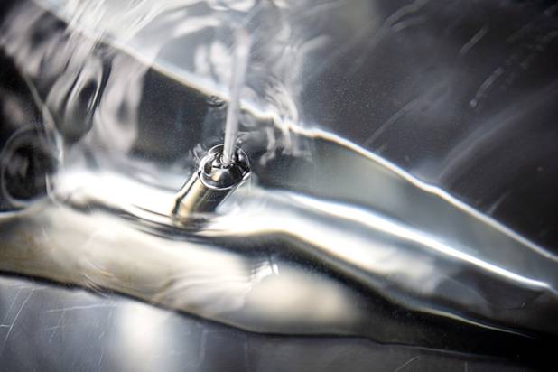 A hydrometer, used to determination the percentage of alcohol, is shown in a vat of hand sanitizer at the Las Vegas Distillery in Henderson Wednesday, May 13, 2020. The distillery has switched from making distilled spirits to hand sanitizer in order to help in the fight against the novel coronavirus (COVID-19).