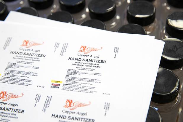 Hand sanitizer labels are shown at the Las Vegas Distillery in Henderson Wednesday, May 13, 2020. The distillery has switched from making distilled spirits to hand sanitizer in order to help in the fight against the novel coronavirus (COVID-19).