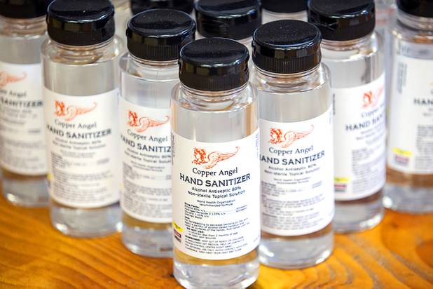 Bottles of hand sanitizer are displayed at the Las Vegas Distillery in Henderson Wednesday, May 13, 2020. The distillery has switched from making distilled spirits to hand sanitizer in order to help in the fight against the novel coronavirus (COVID-19).