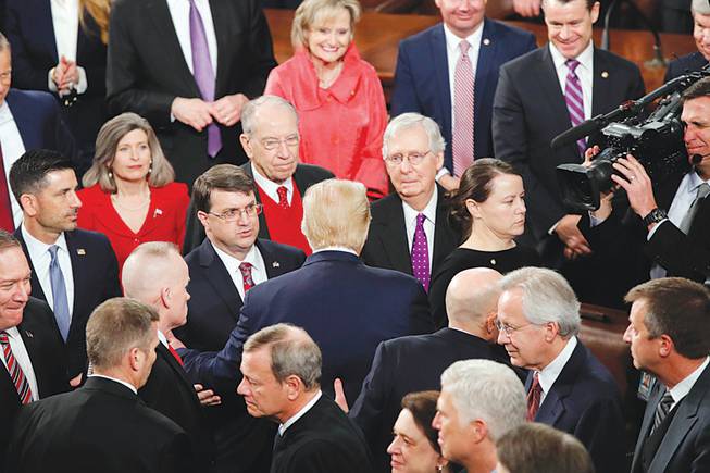 President Donald Trump greets Republicans after his State of the Union address to a joint session of Congress in February. This president and his party have shown they’ll sideline any member of the administration who isn’t a partisan loyalist. 