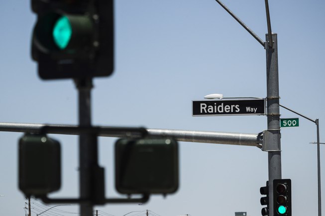 A newly installed Raiders Way street sign is posted at ...