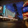 In this March 21, 2020, photo, a sign indicates to "Stay Home for Nevada" along a usually busy Fremont Street after casinos were ordered to shut down due to the coronavirus outbreak in Las Vegas. Nevada gambling regulators are calling casino companies to a health and safety workshop next week aimed at sharpening rules for reopening the state's shuttered gambling establishments.