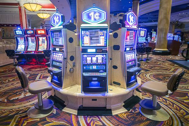 Slot machines, with chairs removed for social distancing, are shown on the casino floor during a tour of Caesars Palace Thursday, May 21, 2020.