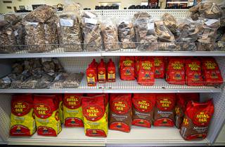 A variety of wood and charcoal is displayed at Larry's Great Western Meats, 420 S. Valley View Blvd., Thursday, May 21, 2020.