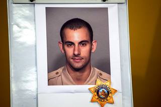 A photo of Metro Police officer Shay K. Mikalonis, 29, a four-year veteran of the department, is displayed during a media briefing at Las Vegas Metro Police Headquarters Tuesday, June 2, 2020. Mikalonis was shot near Circus Circus Monday night, June 1, 2020, during a George Floyd protest.