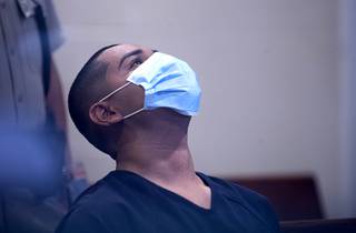 Edgar Samaniego leans his head back as he waits to make an initial appearance at the Regional Justice Center Wednesday, June 3, 2020. Samaniego is accused of shooting and critically injuring Metro Police Officer Shay Mikalonis, 29, near Circus Circus Monday night.