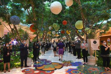 Wynn Las Vegas employees welcome guests during the resort’s reopening on June 4.