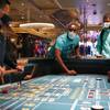 People play craps after the reopening of the Bellagio Thursday, June 4, 2020, in Las Vegas.
