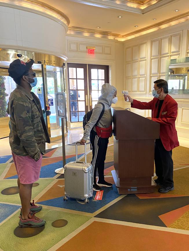 Hotel guests receive temperature screens at Treasure Island.
