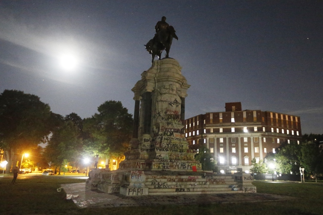 The Moon illuminates the statue of Confederate General Robert E. ...
