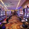 In this May 21, 2020, photo, chairs have been removed at some electronic slot machines to maintain social distancing at a closed Caesars Palace in Las Vegas. Nevada casinos were closed throughout May due to the coronavirus pandemic.