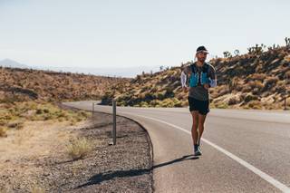 Skyler Holloway makes his way up Kyle Canyon Rd towards Mt Charleston during a 100km (62mi) ultra run from the Welcome to Las Vegas sign to Mt. Charleston Peak, Wednesday, July 15, 2020.