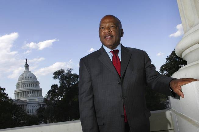 In this Wednesday, Oct. 10, 2007, file photo, with the Capitol Dome in the background, U.S. Rep. John Lewis, D-Ga., is seen on Capitol Hill in Washington. Lewis, who carried the struggle against racial discrimination from Southern battlegrounds of the 1960s to the halls of Congress, died Friday, July 17, 2020. 